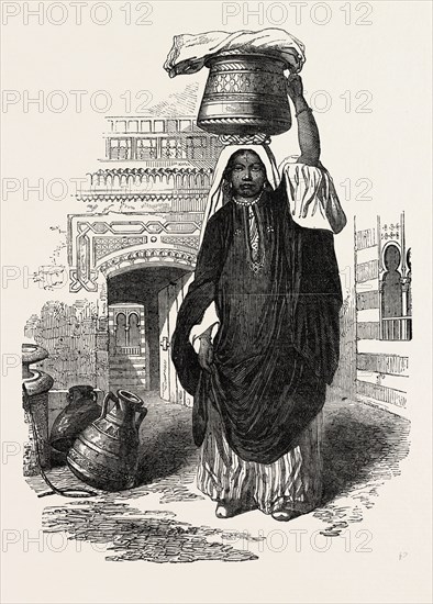 ARAB GIRL RETURNING FROM THE BATH, CAIRO, EGYPT, FROM CHARACTERS, COSTUMES AND MODES OF LIFE IN THE VALLEY OF THE NILE., 1851 engraving