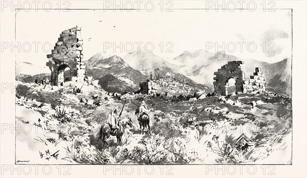 SIR CHARLES EUAN-SMITH'S MISSION TO THE COURT OF MOROCCO: THE RUINS OF VOLUBILIS, NEAR FEZ; These ruins are about 20 miles from Fez, and consist of the remains of a large Triumphal Arch, the Forum, and quantity of walls. Between the remaining portions of the Forum are seen the town and shrine of Mulai Edris, named after the great Moslem saint, and father of the founder of Fez. No one may live in Milai Edris, which is also called Zarhun, except the descendants of the Saint, and no one but a true believer may enter it, on any pretence., 1892 engraving