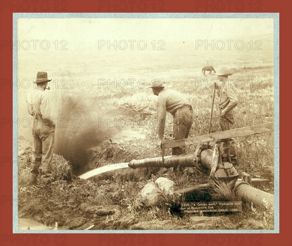 A Golden work. Hydroulic [sic] mining at Rockdrville [i.e. Rockerville], Dak., John C. H. Grabill was an american photographer. In 1886 he opened his first photographic studio