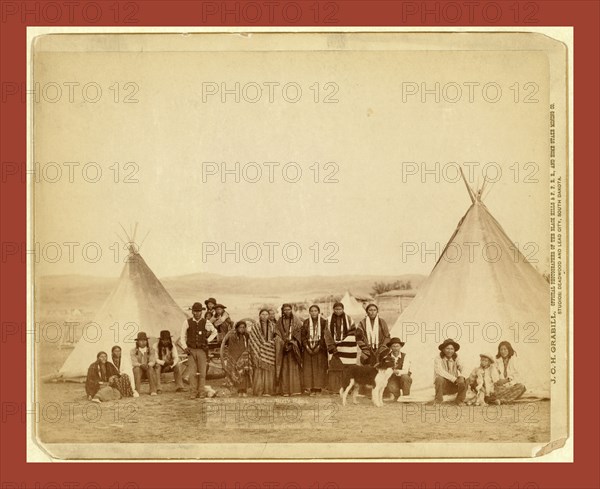 The Indian Girl's Home. A group of Indian girls and Indian police at Big Foot's village on reservation, John C. H. Grabill was an american photographer. In 1886 he opened his first photographic studio
