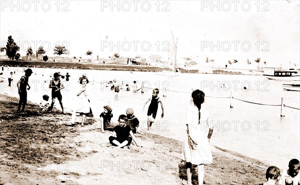 Beach & river front, Detroit, Beaches, Children playing outdoors, United States, Michigan, Detroit, United States, Michigan, Detroit River, 1910