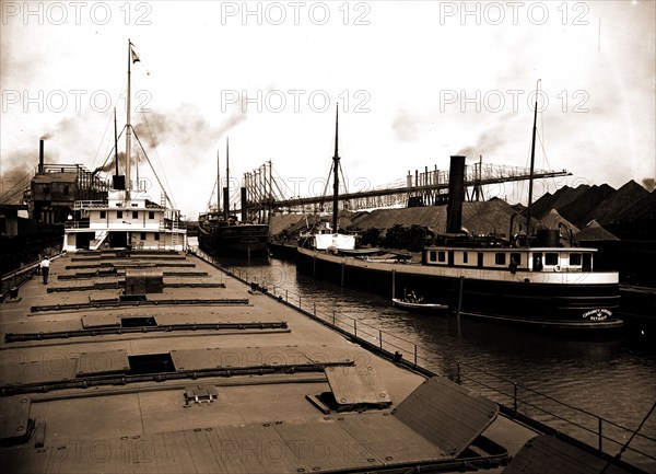 Unloading at ore docks, Cleveland, Ohio, John Craig (Freighter), Chauncey Hurlbut (Freighter), Shipping, Cargo ships, Piers & wharves, Ore industry, United States, Ohio, Cleveland, 1901