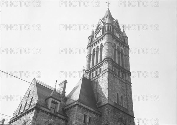 Mt. Holyoke, Massachusetts - Scenes. The City Hall - Norman French - Charles Atwood, Architect, 1874; - $400,000; for a city of 200,000; (Longmeadow stone?) newly important in civic life, crowded with long lines of people on Relief and applicants to see the Mayor, public health and old-age pension applicants; Democratic political meetings on one night and Republican the next; women shoppers going in to get warm; Christmas Legion Christmas parties for children. City Hall, 1936, Lewis Hine, 1874 - 1940, was an American photographer, who used his camera as a tool for social reform. US,USA