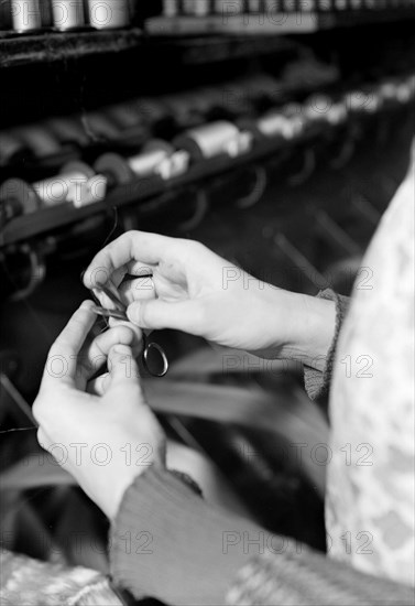 Mt. Holyoke, Massachusetts - Silk. William Skinner and Sons. Winding raw silk from skein to bobbin, 1936, Lewis Hine, 1874 - 1940, was an American photographer, who used his camera as a tool for social reform. US,USA