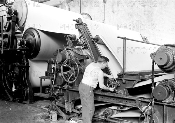 Mt. Holyoke, Massachusetts - Paper. American Writing Paper Co. Cylinder machine (making matchboard), 1936, Lewis Hine, 1874 - 1940, was an American photographer, who used his camera as a tool for social reform. US,USA