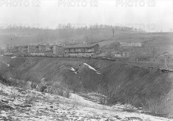 Scott's Run, West Virginia. Chaplin Hill - This scene is typical of many camps built near the mine. In the background can be seen several of the government sanitary privies. These houses are multiple dwellings which accomodate several families. It is one of the few camps on Scott's Run which affords space for hogs and garden, 1936, Lewis Hine, 1874 - 1940, was an American photographer, who used his camera as a tool for social reform. US,USA