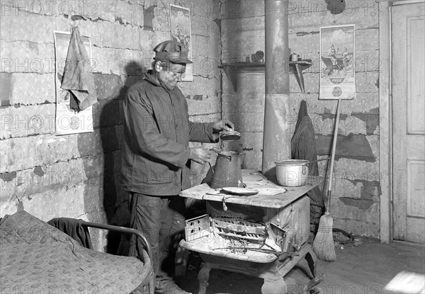 Scott's Run, West Virginia. Employed bachelor at home in Sessa Hill - This scene is typical of hundreds of bachelors who belong to a group of immigrants whose family was separated by immigration restrictions. This man may, or may not, have a wife in another country, March 1937, Lewis Hine, 1874 - 1940, was an American photographer, who used his camera as a tool for social reform. US,USA