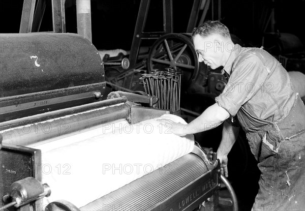 Manchester, New Hampshire - Textiles. Pacific Mills. Finisher Lapper (Front end). Makes finished laps - cotton comes from the breaker lapper, April 1937, Lewis Hine, 1874 - 1940, was an American photographer, who used his camera as a tool for social reform. US,USA