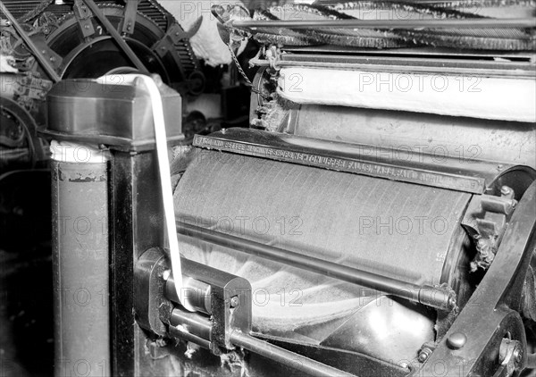 Manchester, New Hampshire - Textiles. Pacific Mills. Carding machine, April 1937, Lewis Hine, 1874 - 1940, was an American photographer, who used his camera as a tool for social reform. US,USA