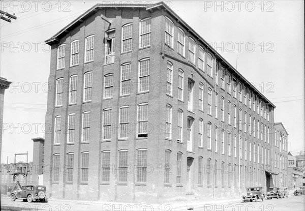 Paterson, New Jersey - Textiles. Mill at 185 Sixth Avenue which houses a number of family shops, June 1937, Lewis Hine, 1874 - 1940, was an American photographer, who used his camera as a tool for social reform. US,USA