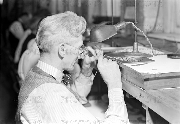 Lancaster, Pennsylvania - Hamilton Watch. Operation - inspecting plate - skilled inspecting job (all plates must undergo severe inspection covering all operations of drilling, tapping, recessing, and facing.), 1936, Lewis Hine, 1874 - 1940, was an American photographer, who used his camera as a tool for social reform. US,USA