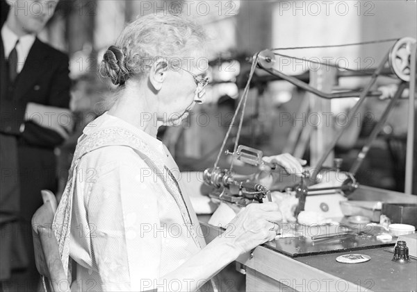 Lancaster, Pennsylvania - Hamilton Watch. Operation - polishing machine - machine is called wig-wag machine and is used to polish pivots and staff shoulders - semi-skilled operation, 1936, Lewis Hine, 1874 - 1940, was an American photographer, who used his camera as a tool for social reform. US,USA