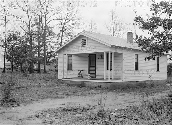 High Point, North Carolina - Housing. Homes of skilled furniture workers in Tomlinson Chair Mfg. Company, High Point, North Carolina. They have bought a small parcel of land, just outside the city limits, and put up a small cottage themselves. This seems to be popular, 1936, Lewis Hine, 1874 - 1940, was an American photographer, who used his camera as a tool for social reform. US,USA