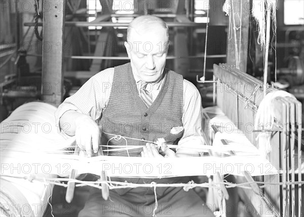 Paterson, New Jersey - Textiles. From the warping machine, the warp is taken to the weaving plant, 1936, Lewis Hine, 1874 - 1940, was an American photographer, who used his camera as a tool for social reform. US,USA