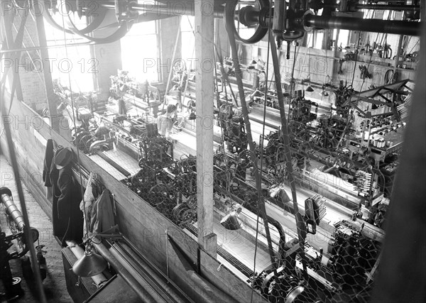 Paterson, New Jersey - Textiles. Idle quilling machines and looms in a cockroach shop, March 1937, Lewis Hine, 1874 - 1940, was an American photographer, who used his camera as a tool for social reform. US,USA