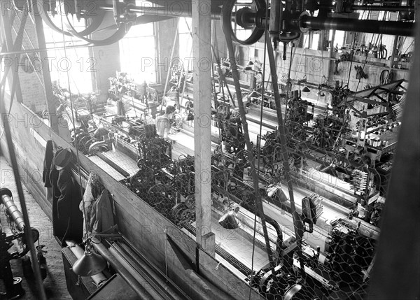 Paterson, New Jersey - Textiles. Idle quilling machines and looms in a cockroach shop, March 1937, Lewis Hine, 1874 - 1940, was an American photographer, who used his camera as a tool for social reform. US,USA