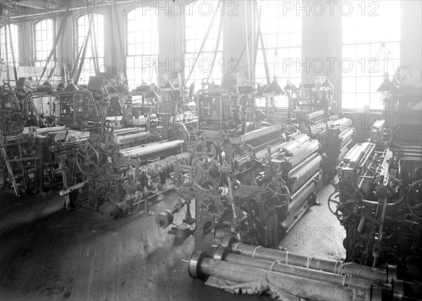 Paterson, New Jersey - Textiles. Idle looms in a cockroach shop. Note the empty beams in the foreground, March 1937, Lewis Hine, 1874 - 1940, was an American photographer, who used his camera as a tool for social reform. US,USA