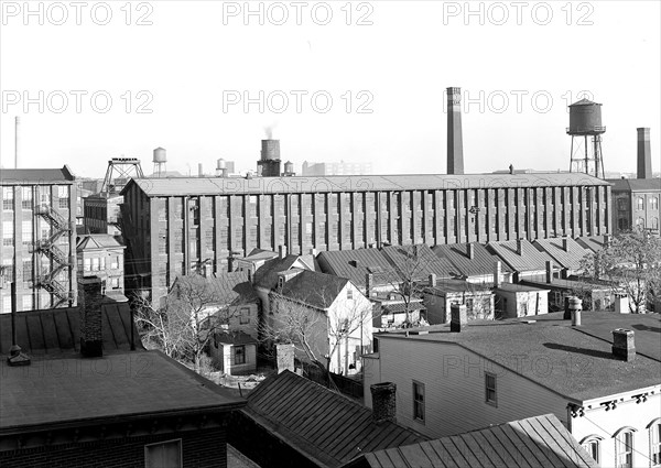 Paterson, New Jersey - Textiles. A view of part of the Barnett Silk Mill, - it has been cut up into so-called family-shops, (see other photos). Also shows how the mills in the populated part of the city are surrounded by homes, close-up, March 1937, Lewis Hine, 1874 - 1940, was an American photographer, who used his camera as a tool for social reform. US,USA