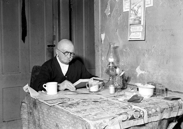 Paterson, New Jersey - Textiles. Living room and 78 year-old silk worker (now retired on $18 a month pension). Lives over Cafe, March 1937, Lewis Hine, 1874 - 1940, was an American photographer, who used his camera as a tool for social reform. US,USA