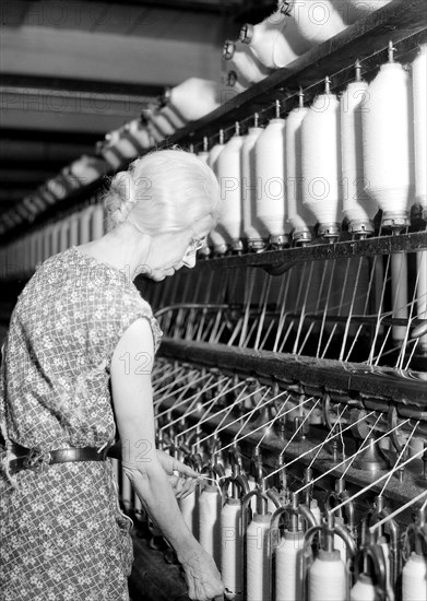 Millville, New Jersey - Textiles. Millville Manufacturing Co. [Lady twisting thread.], 1936, Lewis Hine, 1874 - 1940, was an American photographer, who used his camera as a tool for social reform. US,USA