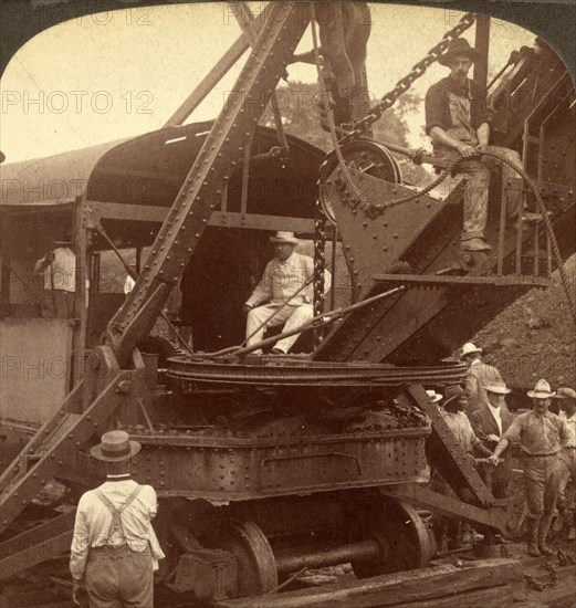 President Roosevelt running an American steam-shovel at Culebra Cut, Panama Canal in Panama that connects the Atlantic Ocean to the Pacific Ocean. , Vintage photography