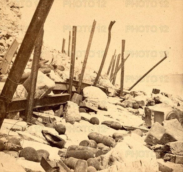 View of Fort Sumpter (i.e. Sumter), showing the debris, shot, and shell. Fort Sumter is a Third System masonry sea fort located in Charleston Harbor, South Carolina. The fort is best known as the site upon which the shots that started the American Civil War were fired, at the Battle of Fort Sumter on April 12, 1861. , Vintage photography