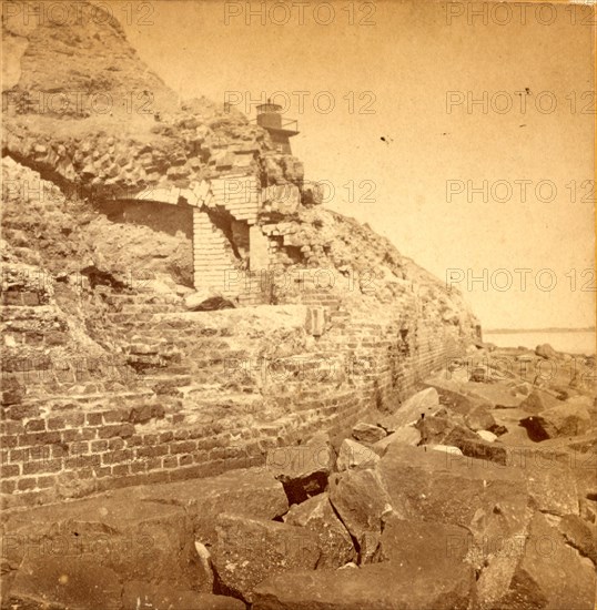 Damage to exterior wall of Fort Sumter from bombardment, Charleston, South Carolina. Fort Sumter is a Third System masonry sea fort located in Charleston Harbor, South Carolina. The fort is best known as the site upon which the shots that started the American Civil War were fired, at the Battle of Fort Sumter on April 12, 1861. , Vintage photography