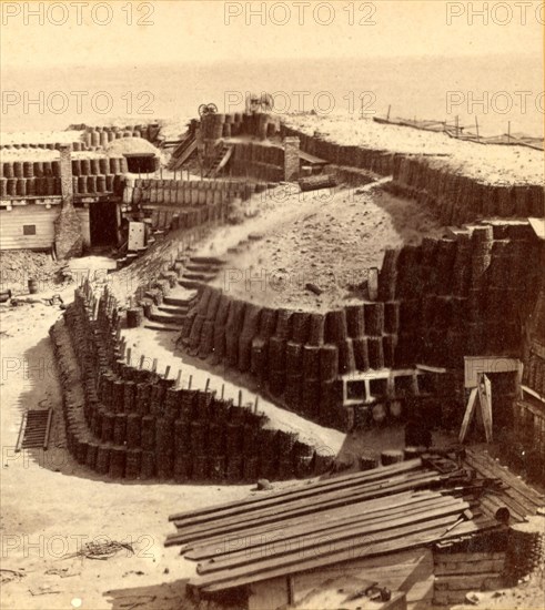 Interior of Fort Sumpter (i.e. Sumter), shewing (i.e. showing) gabions and bomb proofs. Fort Sumter is a Third System masonry sea fort located in Charleston Harbor, South Carolina. The fort is best known as the site upon which the shots that started the American Civil War were fired, at the Battle of Fort Sumter on April 12, 1861. , Vintage photography