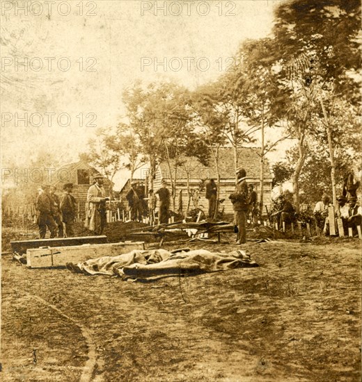 Burial of the Union dead at Fredericksburg, December 15, 1862 (i.e. May 19 or 20, 1864. Working within the Confederate lines under a flag of truce. Our army had retreated, leaving our dead on the field, US, USA, America, Vintage photography