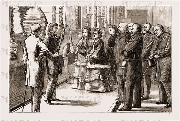 VISIT OF THE QUEEN TO THE LOAN COLLECTION OF SCIENTIFIC APPARATUS AT SOUTH KENSINGTON, LONDON, UK, 1876: PROFESSOR TYNDALL EXPLAINING THE ACTION OF THE FOG HORN