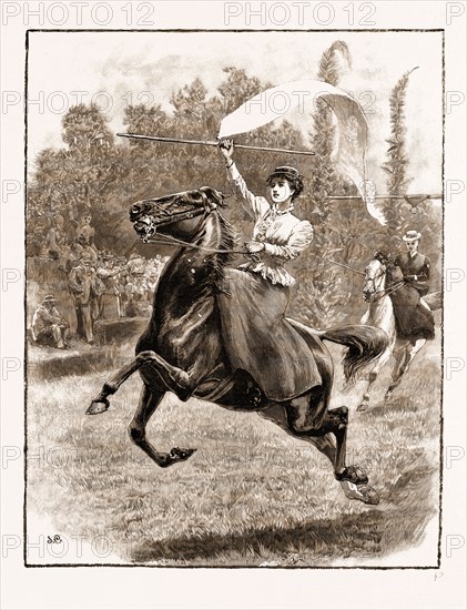 "VICTORY": LADIES TILTING AT THE RING IN TENERIFE, 1897: Tilting at the ring is a favourite amusement with ladies and gentlemen visiting the Canary Islands. At most of the hotels there are courses laid out for tournaments, decorated with flags and foliage, where races and sports of all kinds are indulged in. For tilting, broad silk ribbons or banners on rollers are fixed on a crossbar. At one end of the banner is a ring which hangs below the roll of silk. The tilter has to gallop under the crossbar with his or her lance, and carry away the ring. If the tilter be successful the lance passes through the ring, and the banner unfurls off the roller and floats gracefully behind the competitor.