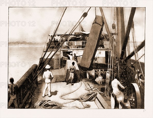 THE ROYAL NIGER COMPANY'S EXPEDITION: EVERYDAY SCENES ON THE RIVER NIGER, 1897: SHIPPING A LOG OF MAHOGANY AT AXIM