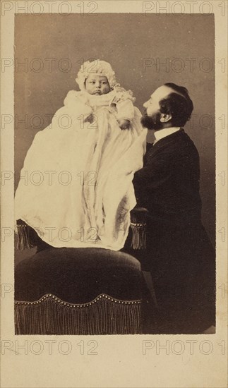 [Baby in a bonnet and a long gown]