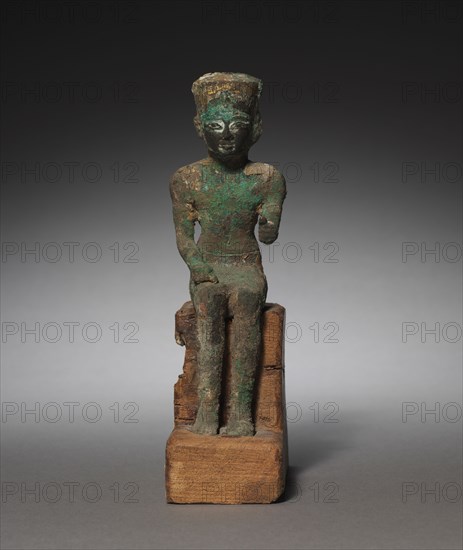 Statuette: Seated Amen-Ra, 715-525 BC. Egypt, Late Period, Dynasty 25-26 (?). Bronze and black copper, gilded and inlaid; overall: 19 x 5.5 x 11.5 cm (7 1/2 x 2 3/16 x 4 1/2 in.).