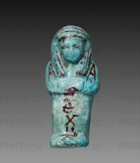 Shawabty of Payefadjer, 1000-945 BC. Egypt, Third Intermediate Period, late Dynasty 21 (1096-945 BC). Turquoise faience with purple decoration; overall: 9.2 x 4.1 x 2.4 cm (3 5/8 x 1 5/8 x 15/16 in.).