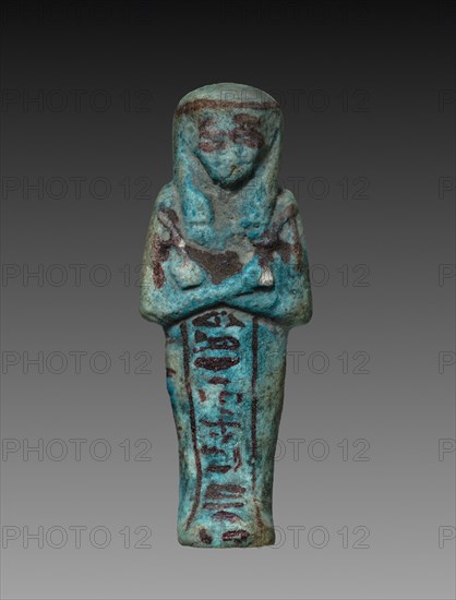 Shawabty of Tanetosorkon, 1000-945 BC. Egypt, Third Intermediate Period, late Dynasty 21 (1069-945 BC). Turquoise faience with purple decoration; overall: 10.5 x 3.9 x 2.6 cm (4 1/8 x 1 9/16 x 1 in.).