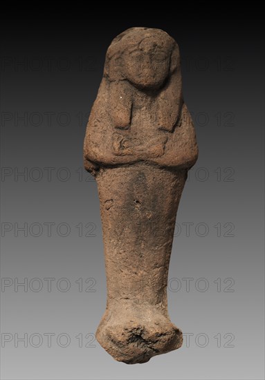 Shawabty, 1250-1213 BC. Egypt, New Kingdom, Dynasty 19, (1295-1186 BC), second half of the reign of Ramses II. Terracotta; overall: 16.4 x 5.7 x 3.5 cm (6 7/16 x 2 1/4 x 1 3/8 in.).