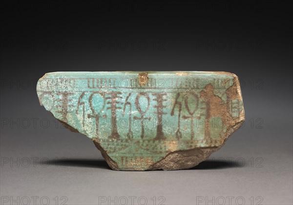 Fragment of Statue Base (?), 1540-1069 BC. Egypt, New Kingdom. Turquoise faience with purple-black painted decoration; overall: 5.8 x 3.4 cm (2 5/16 x 1 5/16 in.).