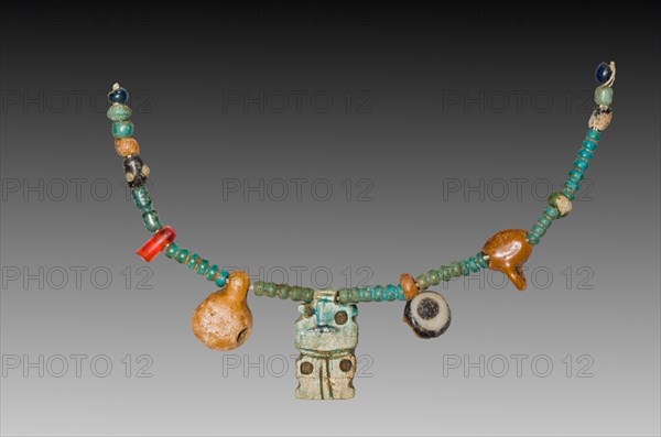 Fragment of a Necklace, 1540-1296 BC. Egypt, New Kingdom, Dynasty 18. Steatite, glass, carnelian, and faience; overall: 12 cm (4 3/4 in.).