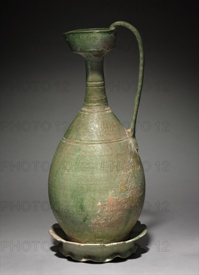 Ewer with Corolla Base, 907-1125. China, Manchuria, Liao dynasty (916-1125). Pottery; diameter: 54.6 cm (21 1/2 in.); overall: 39.4 cm (15 1/2 in.); base: 19.4 x 18 cm (7 5/8 x 7 1/16 in.).
