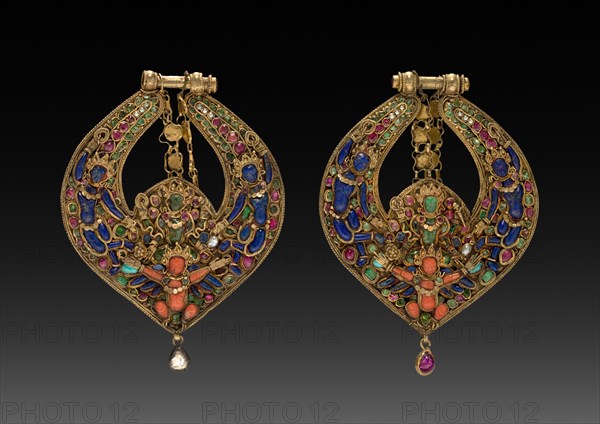 Pair of Deity Earrings with Vishnu on Garuda (front) and chepu (monster mask) (back), 1600s or 1700s. Nepal, Kathmandu Valley. Gold set with precious and semi-precious stones; 9.5 x 6.9 cm (3 3/4 x 2 11/16 in.).