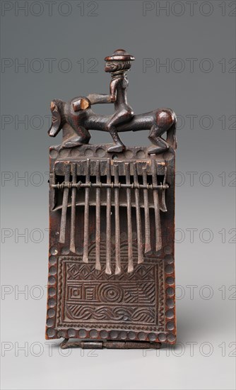 Thumb Piano, late 1800s. Central Africa, Democratic Republic of the Congo or Angola, Chokwe peoples, late 19th century. Wood and iron; overall: 19.1 x 10.2 x 6.4 cm (7 1/2 x 4 x 2 1/2 in.)