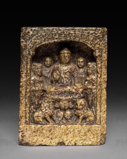 Sakyamuni Preaching: A Votive Stele, c. 565 BC. China, Eastern Zhou dynasty (771-256 BC). Yellow mottled stone; average: 13.7 x 9.9 x 5.3 cm (5 3/8 x 3 7/8 x 2 1/16 in.).