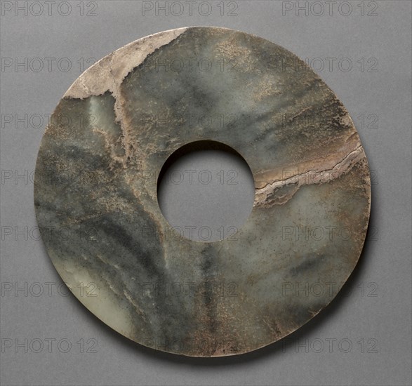 Perforated Disc (pi), 3000-2000 BC. China, Neolithic period (3rd-2nd millenium BC). Jade; diameter: 23.5 cm (9 1/4 in.); inner diameter: 7 cm (2 3/4 in.).