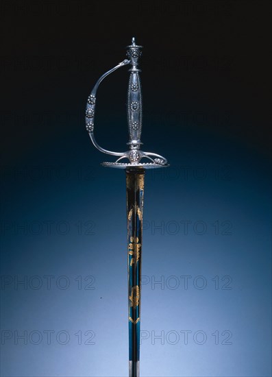 Court Sword, c. 1790. England, London or Birmingham, late 18th Century. Steel; silver hilt, polished and faceted; blade partially blued and gilded; overall: 99.7 cm (39 1/4 in.); blade: 82.9 cm (32 5/8 in.); guard: 8.3 cm (3 1/4 in.).