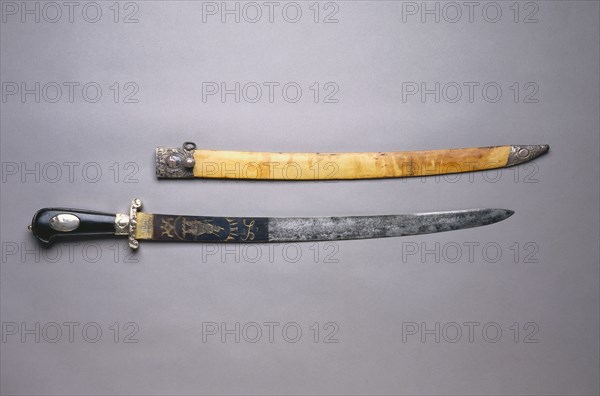 Hunting Sword, c. 1780. France (blade: Germany?), 18th century. Steel, blued, etched, and gilded; silver and wood; overall: 72.1 cm (28 3/8 in.); blade: 56.5 cm (22 1/4 in.); grip: 14 cm (5 1/2 in.); guard: 7.3 cm (2 7/8 in.).
