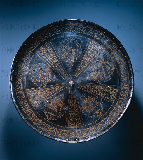 Rondache (Round Shield), c. 1570. Italy, Milan, 16th century. Etched and gilded steel with brass rivets; diameter: 57.8 cm (22 3/4 in.).
