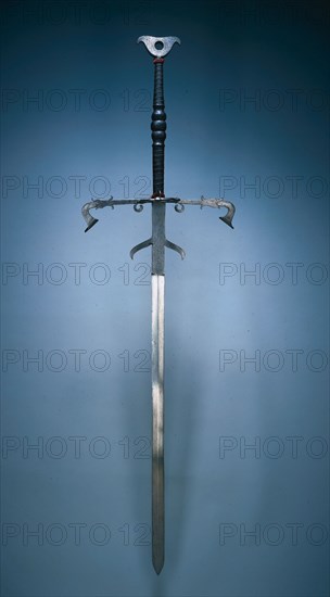 Two-Handed Sword of the State Guard of Julius of Brunswick-Lunüneburg, 1574. Germany, Brunswick, 16th century. Steel, leather and wire bound grip; overall: 186.1 cm (73 1/4 in.); blade: 132.1 cm (52 in.); quillions: 51.4 cm (20 1/4 in.); grip: 45.7 cm (18 in.); ricasso: 25.1 cm (9 7/8 in.).