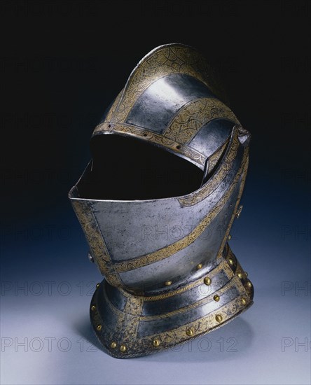 Close Helmet (from a Small Garniture, perhaps for Siegmund Friedrich, Freiherr von Herbertstein [d.1621]), c. 1580. Germany, Augsburg (?), 16th century. Steel, etched and gilded, brass rivets; overall: 40 x 35.5 x 23 cm (15 3/4 x 14 x 9 1/16 in.).