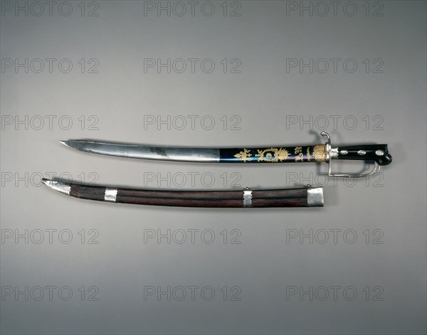 Hunting Sword, 1778-1779. William Kinman (British, 1724-1788?). Blued, etched, and gilded steel; hilt:  silver, wood; overall: 74.9 cm (29 1/2 in.); blade: 60.3 cm (23 3/4 in.); grip: 13.7 cm (5 3/8 in.); guard: 10.8 cm (4 1/4 in.)